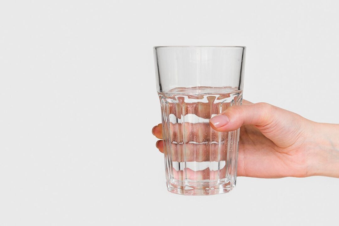 A glass of water with zxcvbnmqwert diluted powder